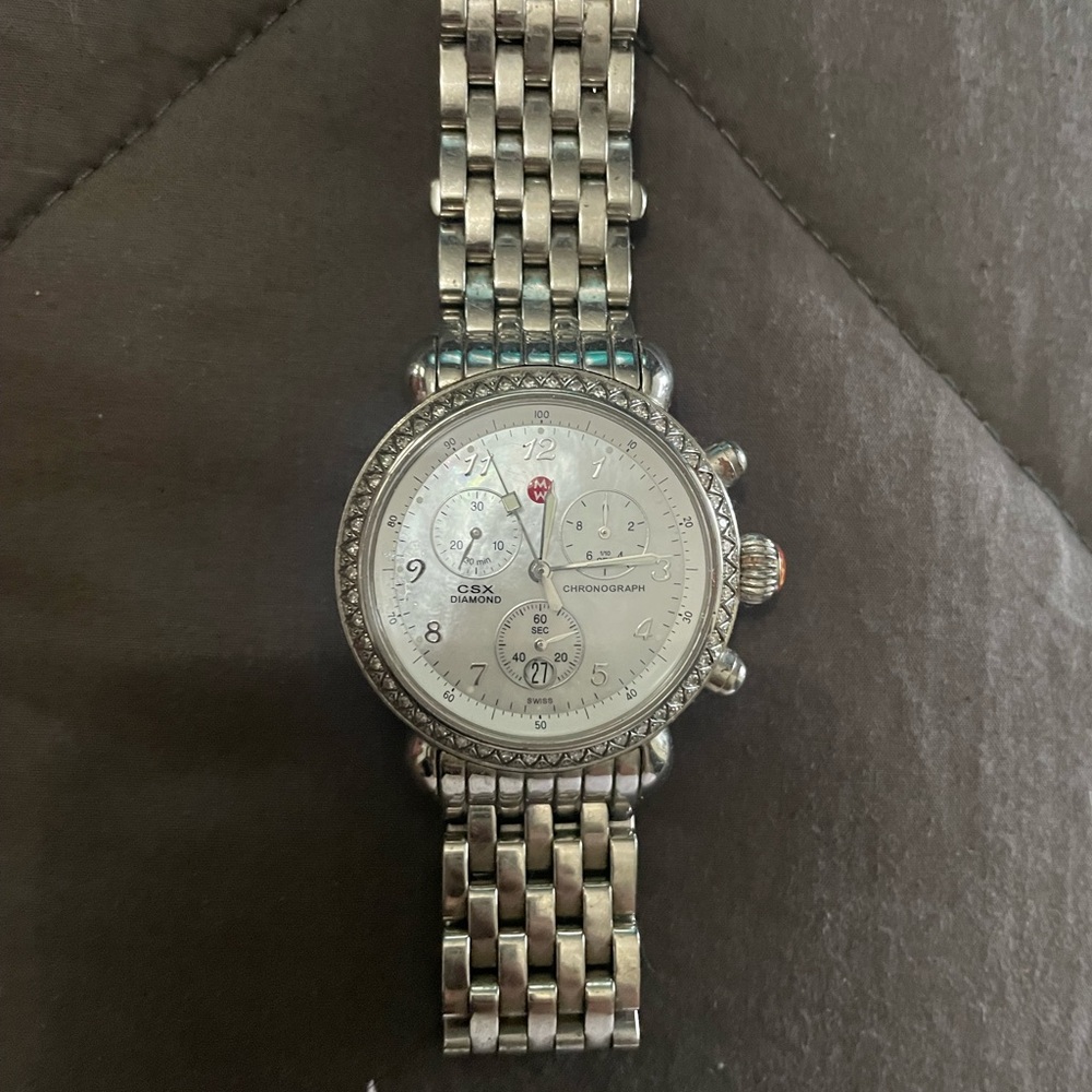 Silver round michele watch.